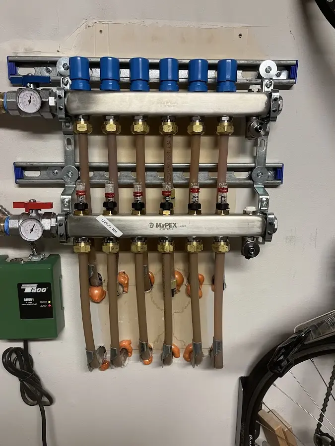 Plumber performing Leak Detection at a residential property in Brookline